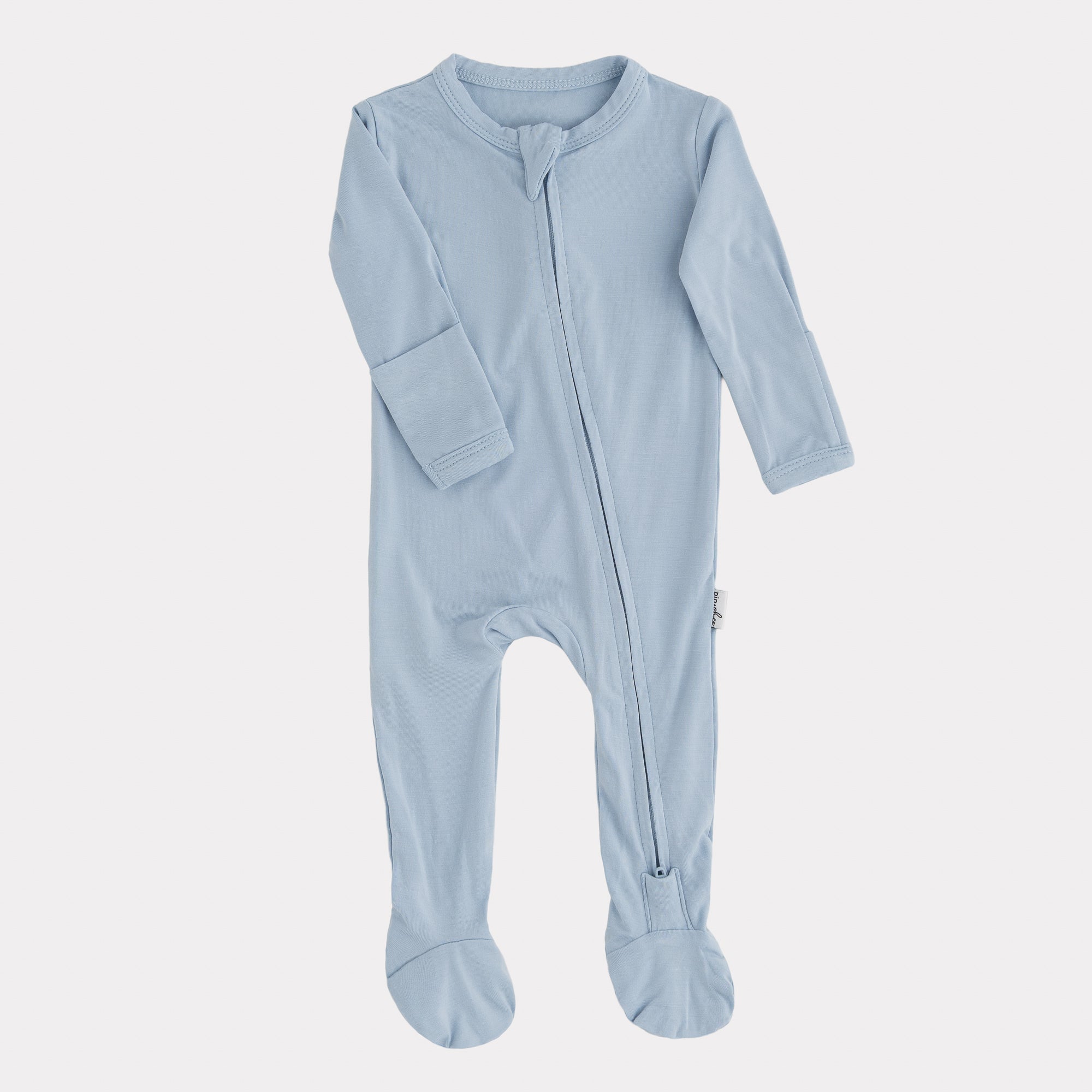 Blue baby onesie with a zipper on a white background