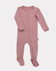 A pink bamboo footed sleeper for babies with a two-way zipper and fold-over mittens.