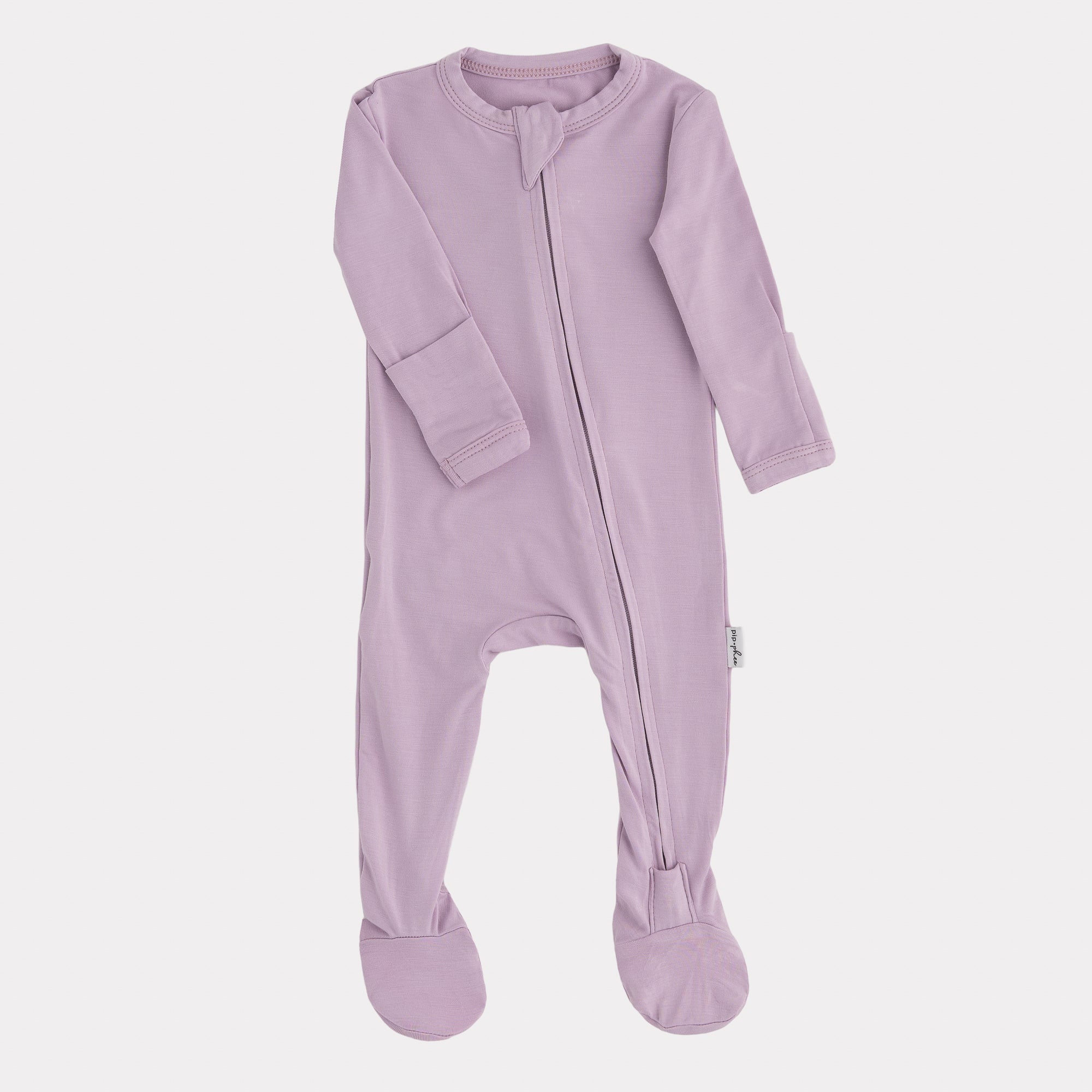 Purple baby onesie with a zipper on a white background