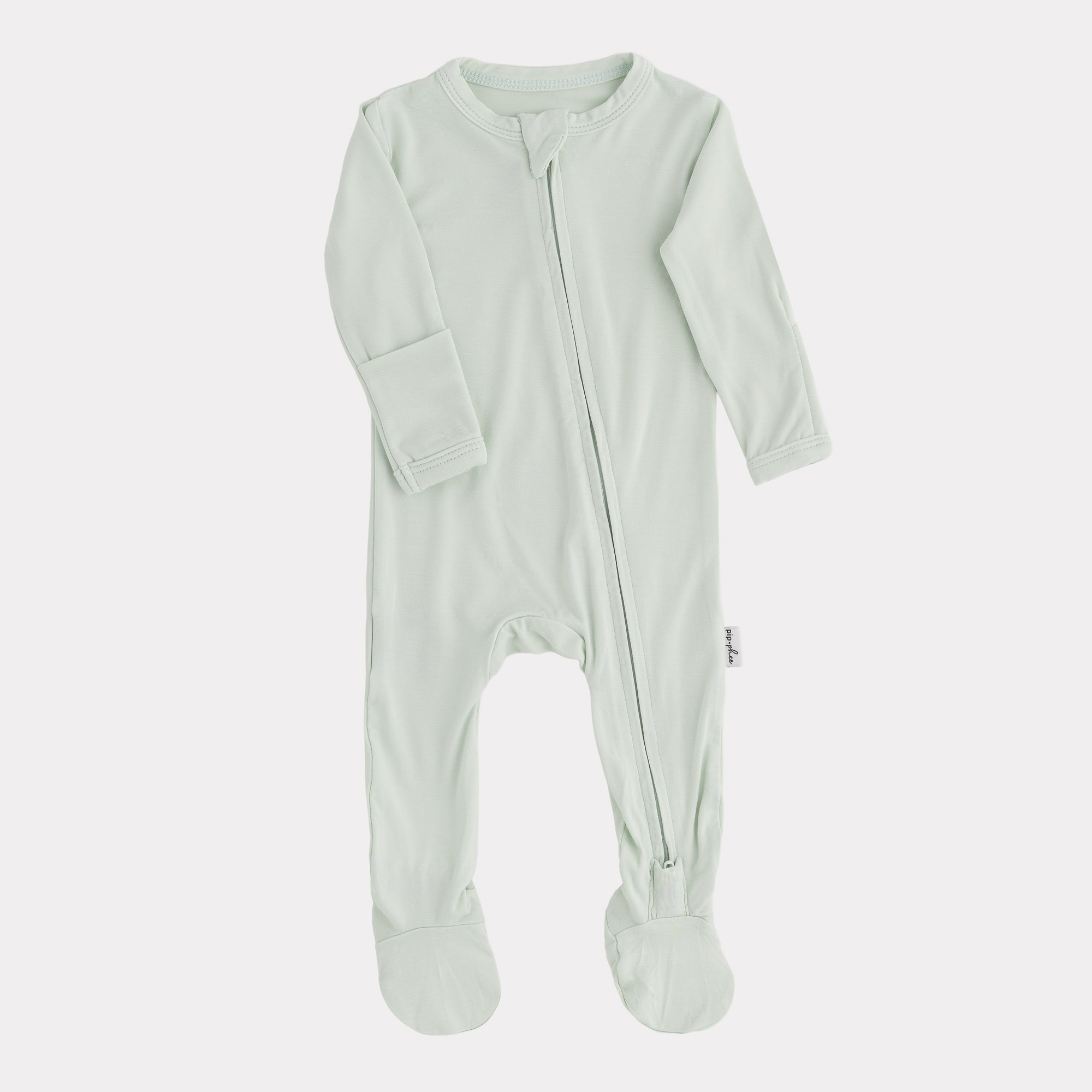 Light green baby onesie with a zipper on a white background