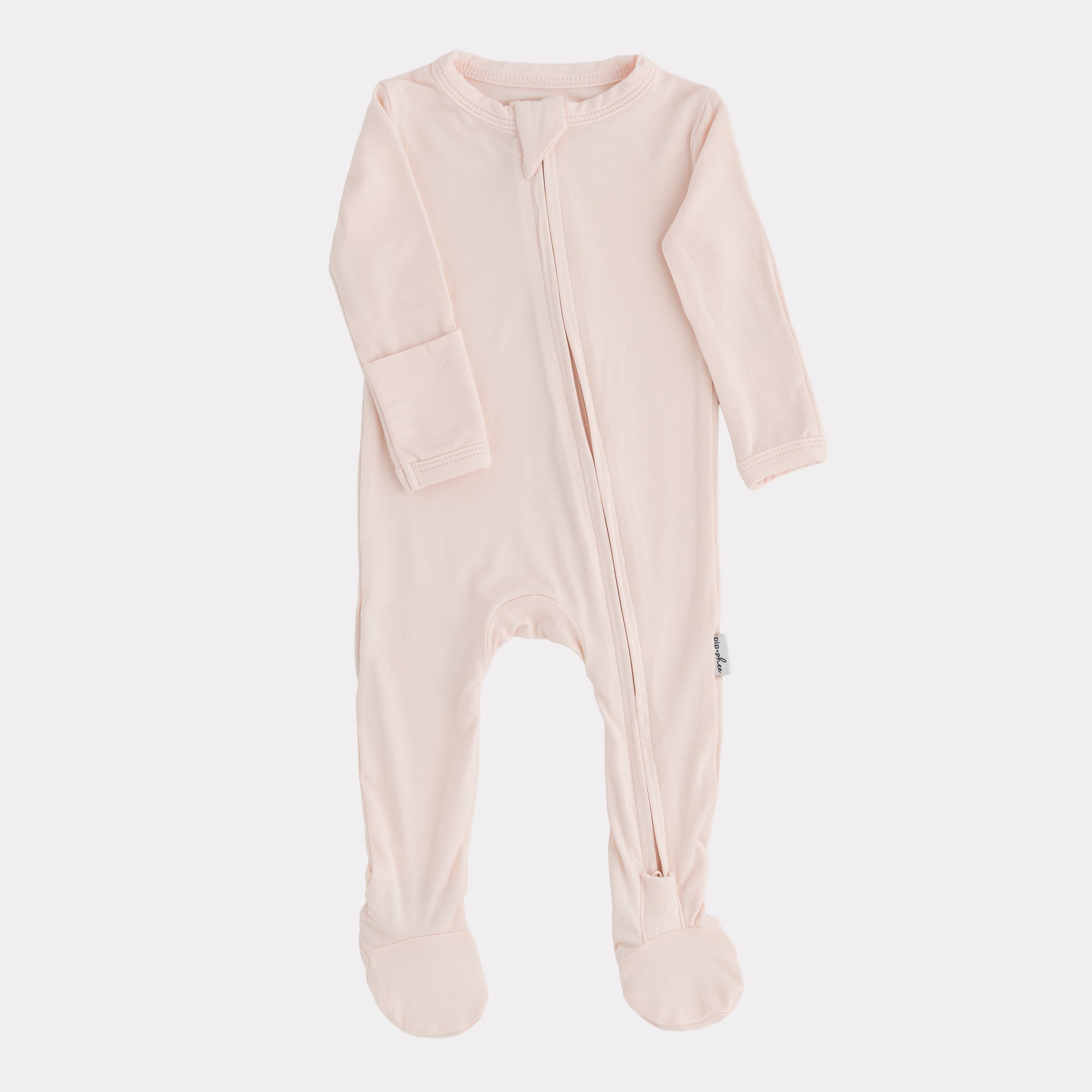 Pink baby onesie with a zipper on a light gray background