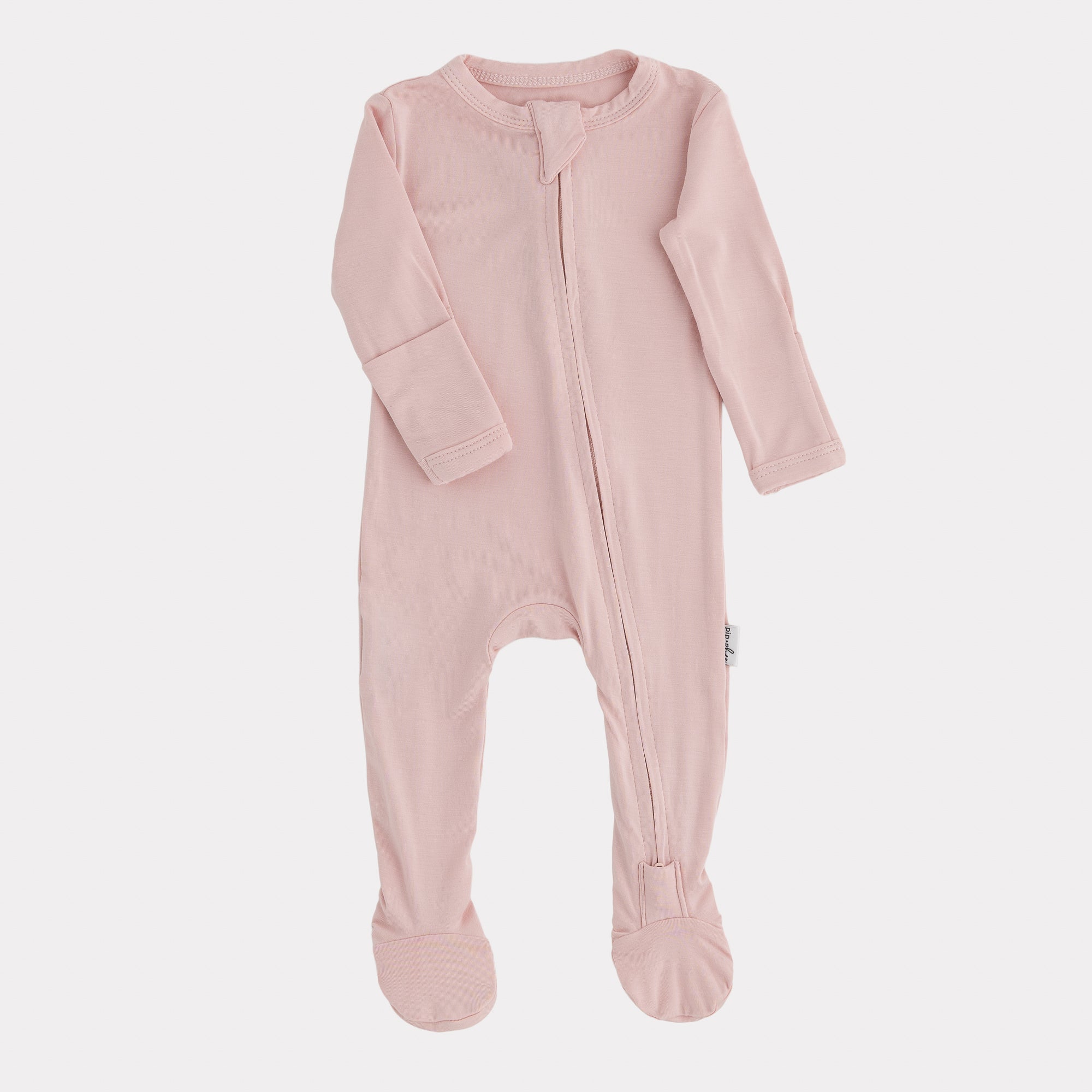 Pink baby onesie with a zipper on a white background